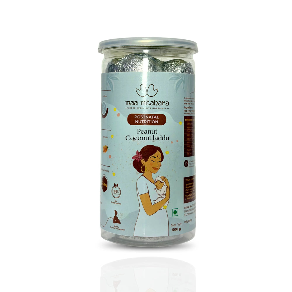 A 300g glass jar of Maa Mithaliha Multigrain Laddu postnatal nutrition, featuring a light blue label with an illustration of a mother holding a baby, set against a plain white background.